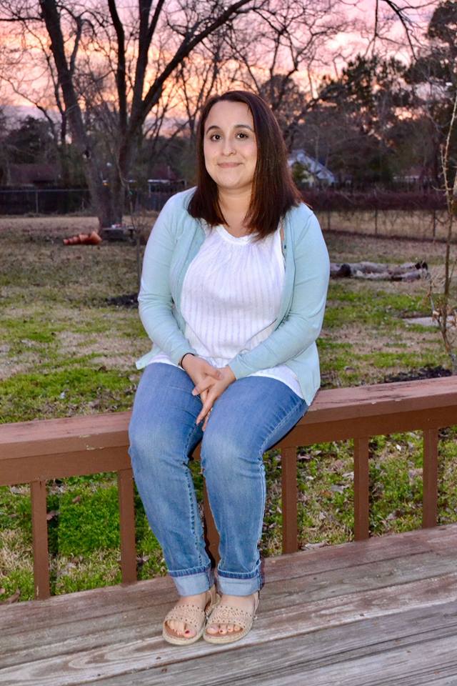 Julita Rincon sits in her backyard