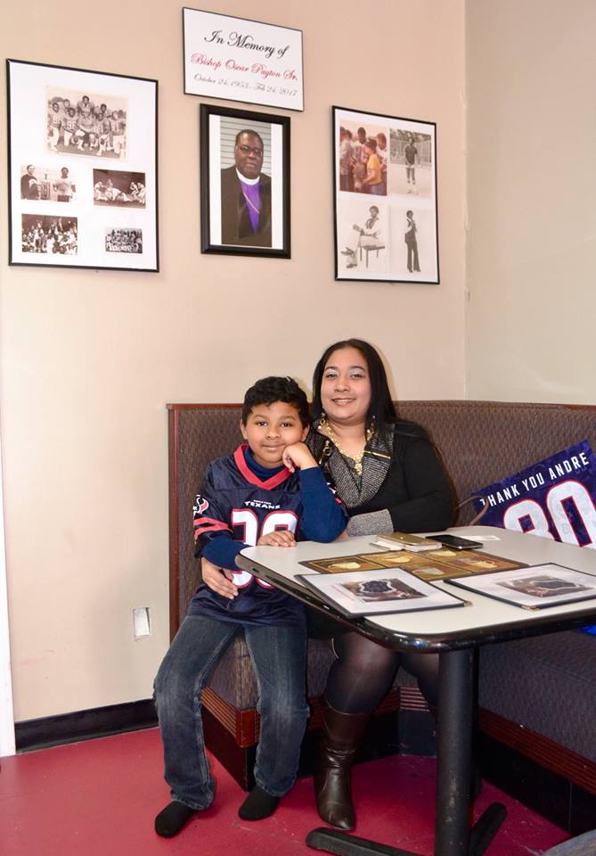Samantha and Oscar Payton sitting in coffee shop