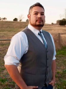 Eric Hatch standing in a field