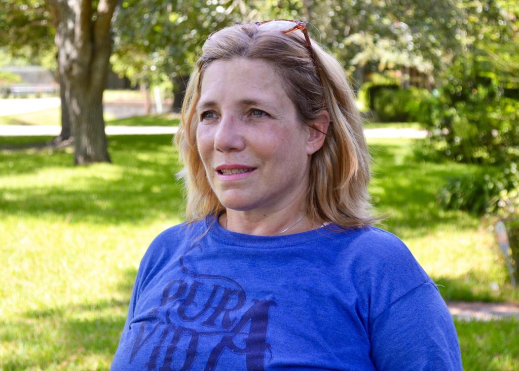 Jennifer Bourgeois stands outside her home