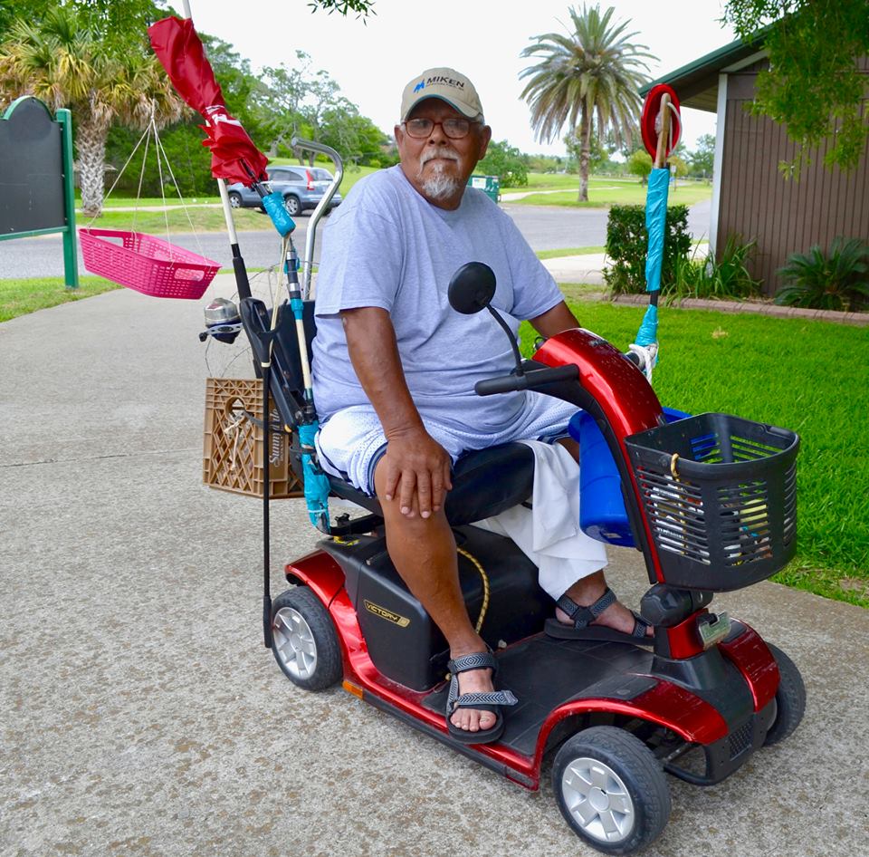 Joe Rangel sits in his electric cart at the park