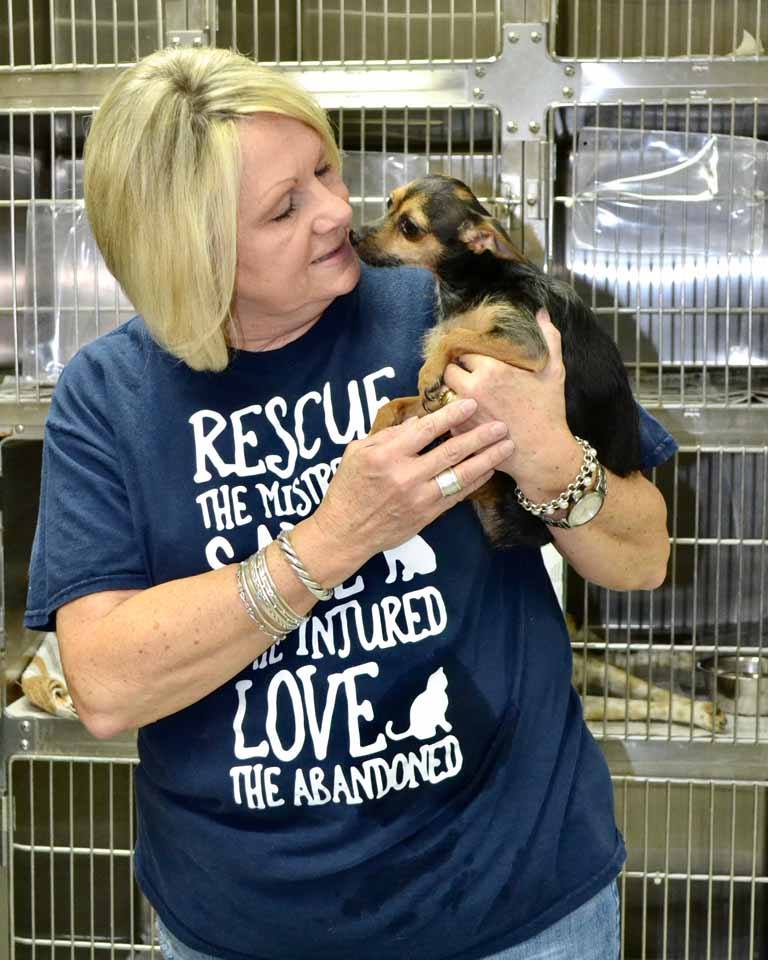 Lou Sisk holds a pully