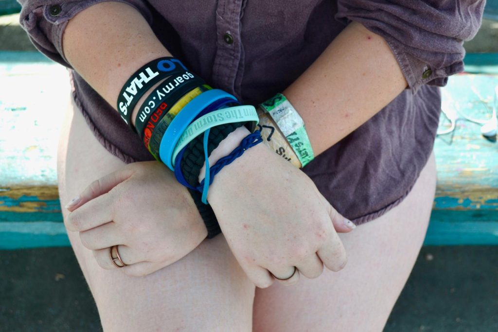 Colored wristbands on your woman's arm