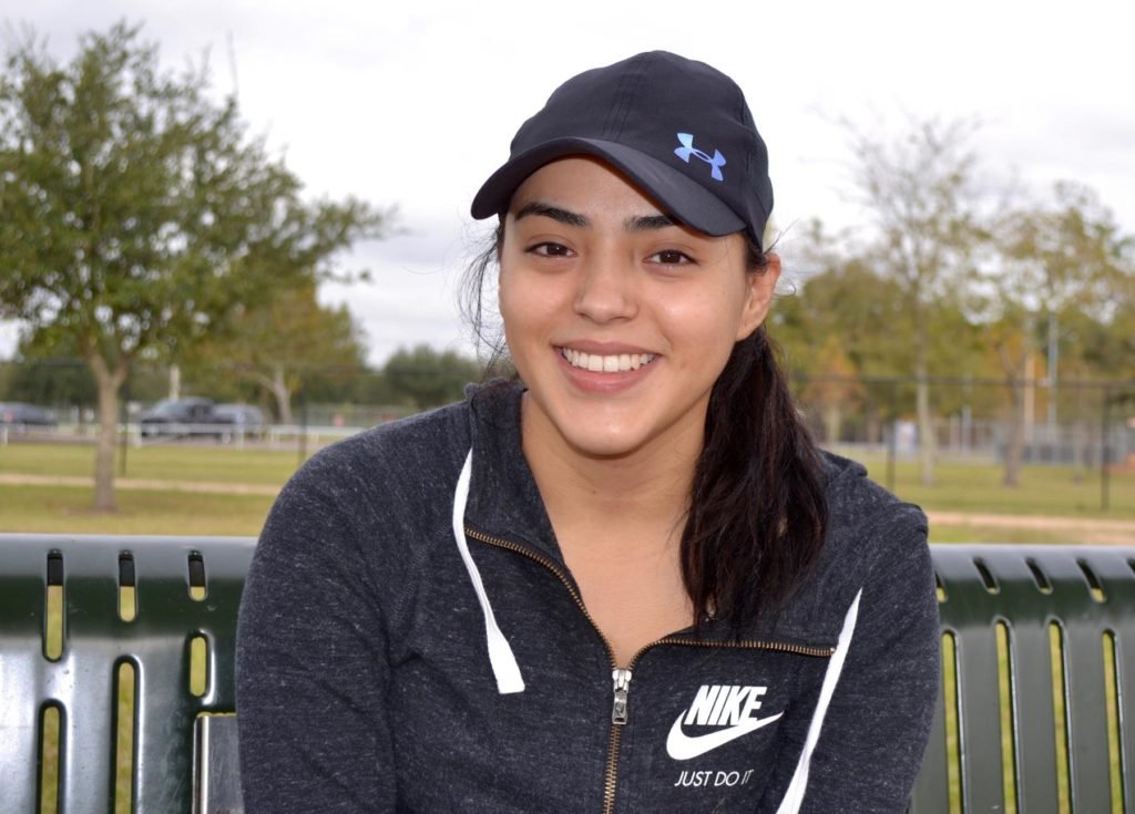 Alex Hernandez smiling while at the dog park