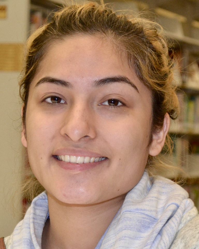 Jennifer Hernandez smiling in library