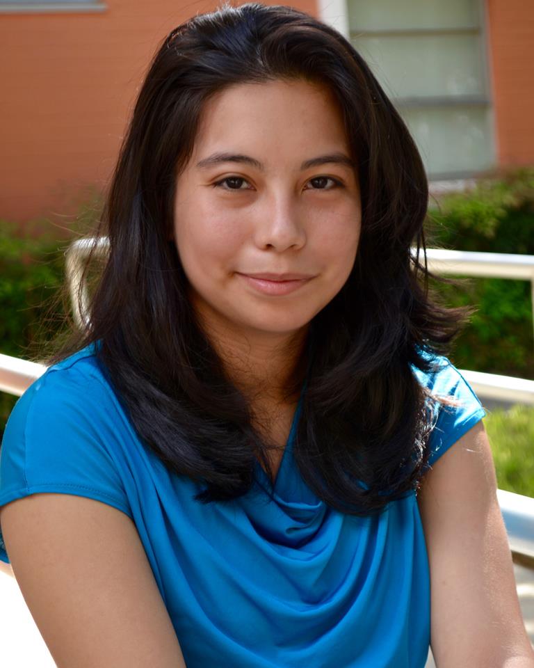 Monica Gutierrez sitting on campus at Lee College