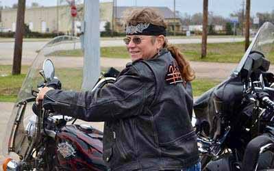 Theresa Cain rides a motorcycle