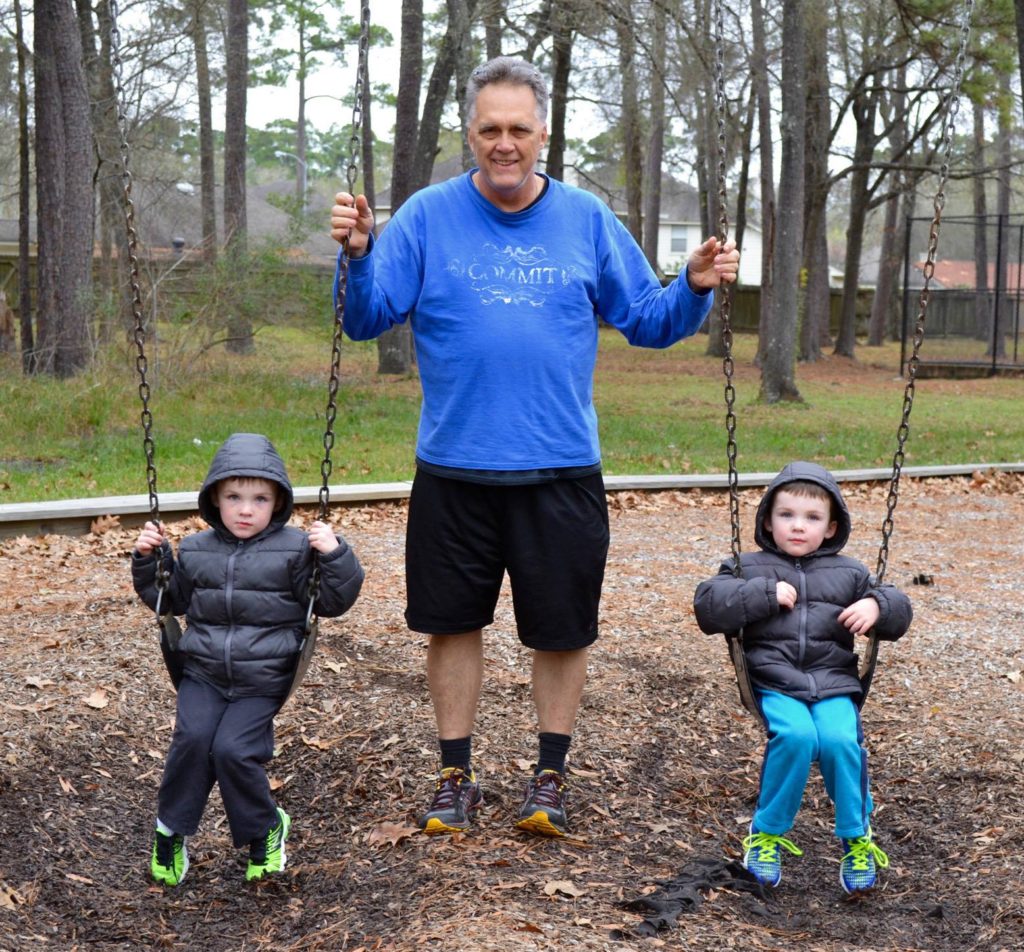 Brett Hilsmeier with his twin grandsons at the park