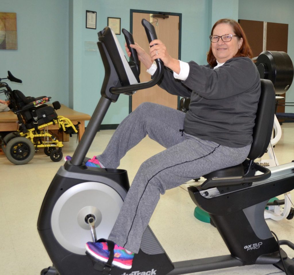 Evelyn Marlow on exercise bike