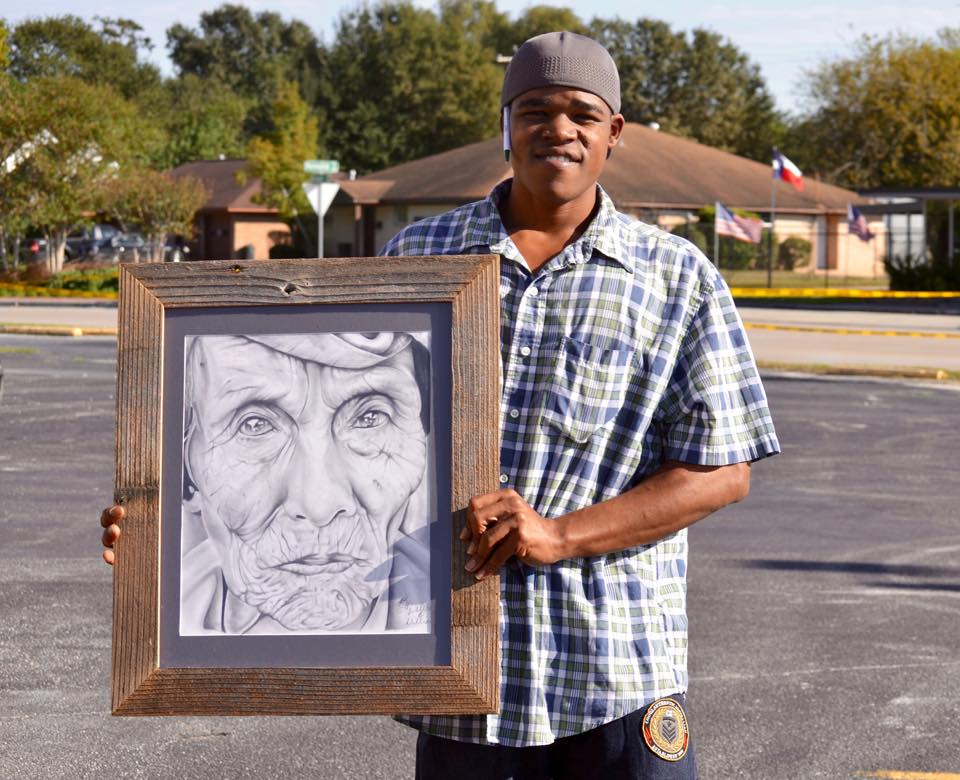Welton Williams holds a drawing