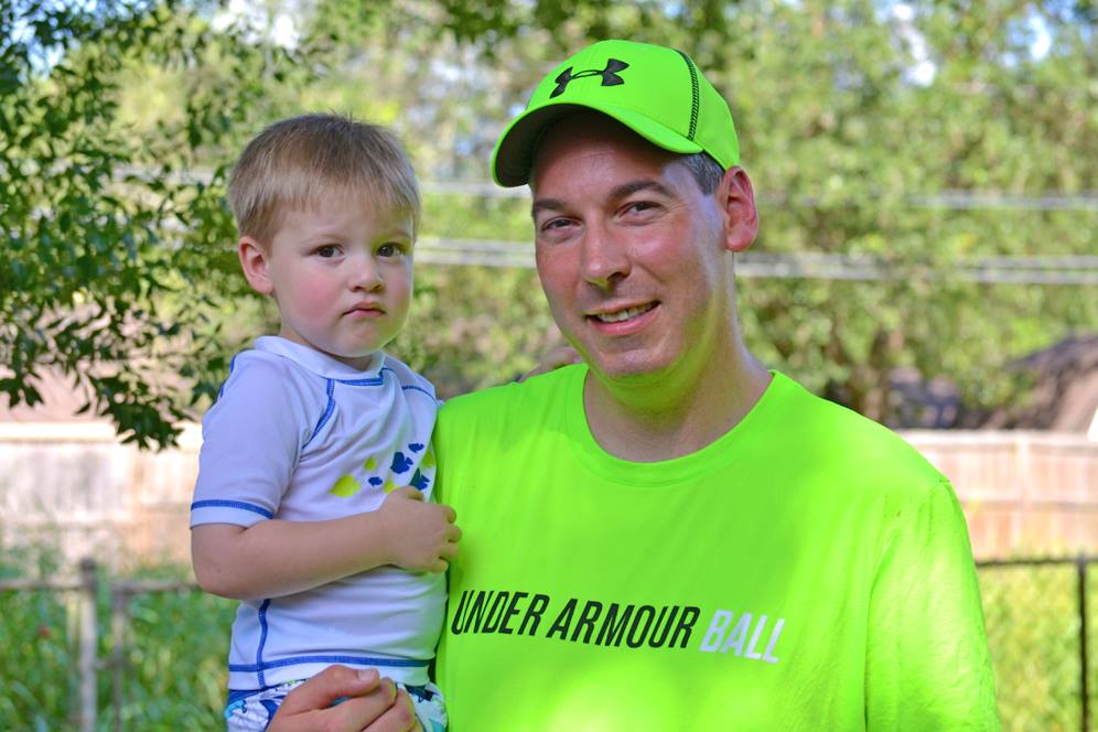 Basketball coach holds son