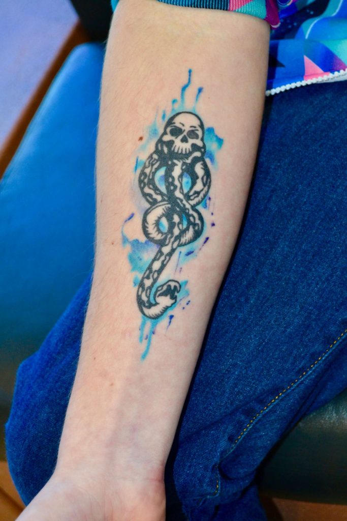 Arm with Harry Potter tattoo