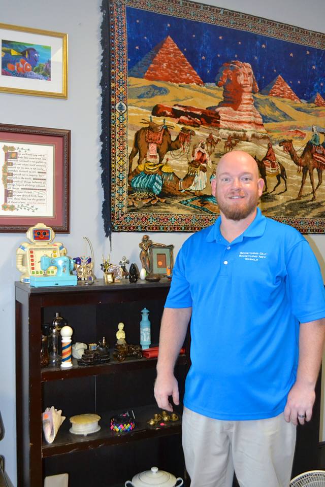 Resale shop owner in store