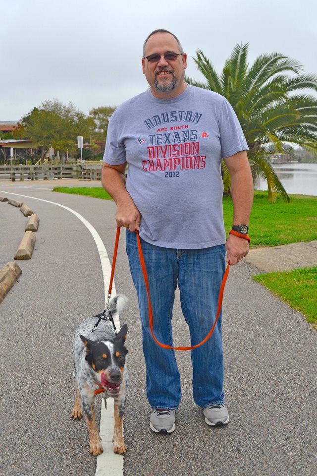 Man walking rescue dog