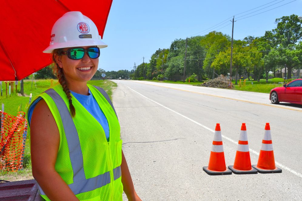Young woman stands near truck