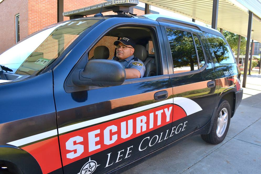 Security officer sits in his vehicle