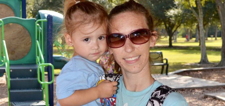 Amber Cox holds her daughter