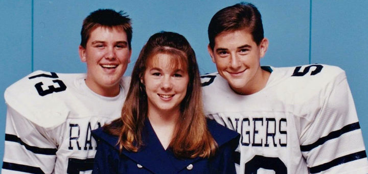 L.J. Stone in high school with two football players