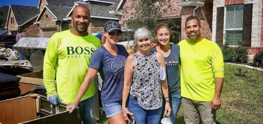 Britt Elliott and others with the owner of a home damaged by Hurricane Harvey