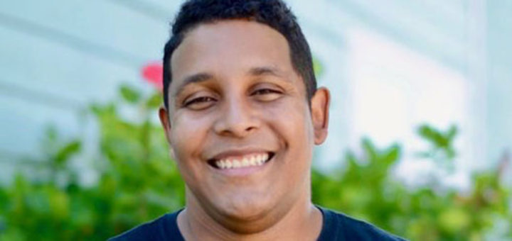 Brandon Williams wearing Galveston Urban Ministries shirt