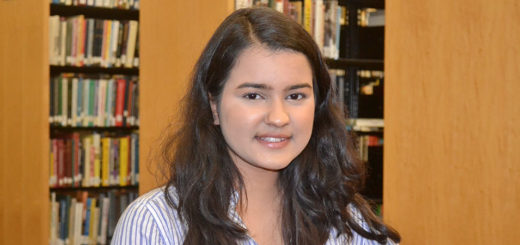 Divya Singh sitting at library