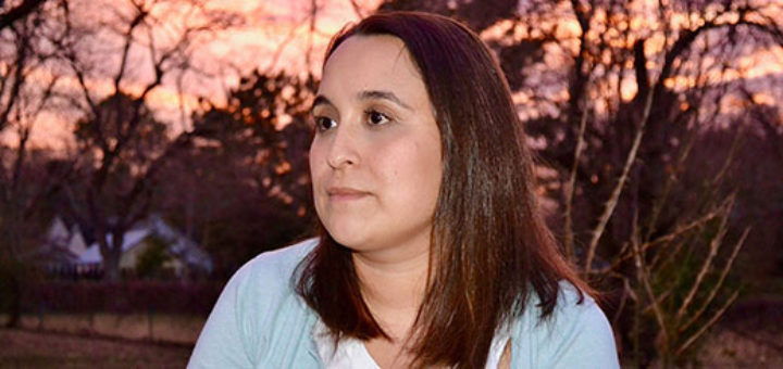 Julita Rincon sits in her backyard