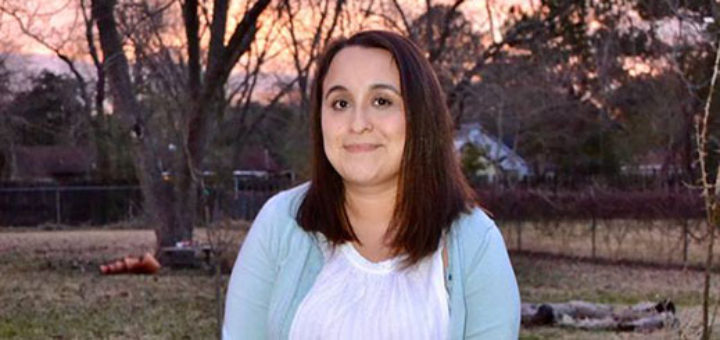 Julita Rincon sits in her backyard