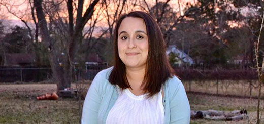 Julita Rincon sits in her backyard