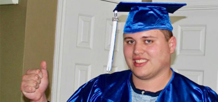 Adam Johnson wearing cap and gown