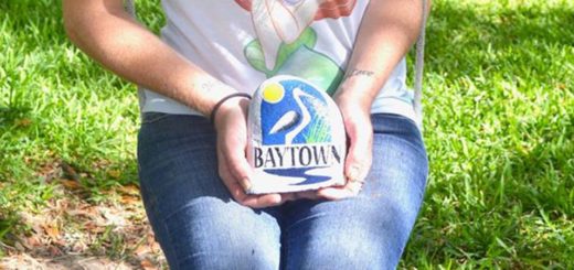 Aly Young holds one of the rocks she painted