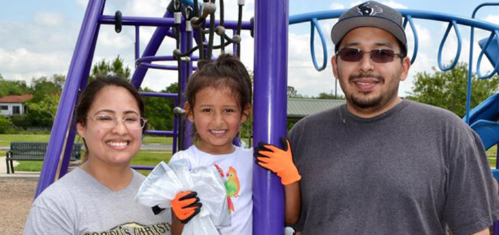 Amy and Alejandro Velez with their daughter at park