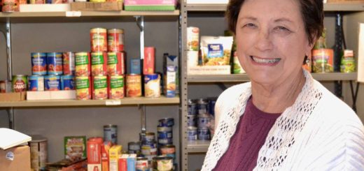 Barbara Wilson with food in her church's pantry