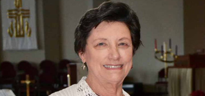 Barbara Wilson stands in her church's sanctuary