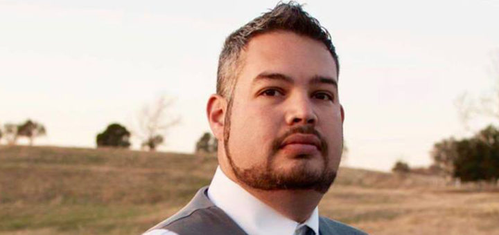 Eric Hatch standing in a field