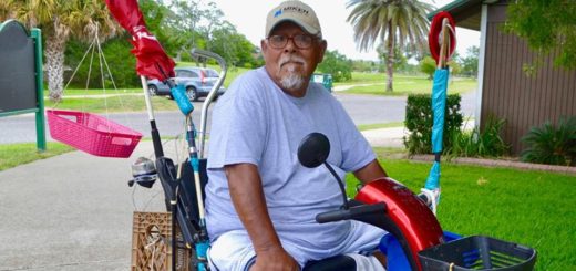 Joe Rangel sits in his electric cart at the park