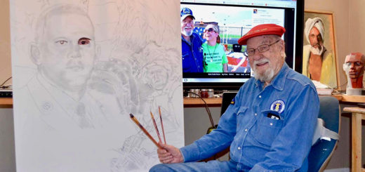 Ken Pridgeon painting in his studio at home