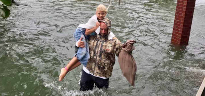 Kyle Cervenka rescues a young girl from flooding waters