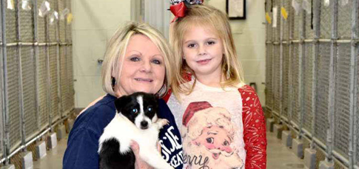 Lou Sisk with her granddaughter at the city animal shelter