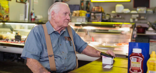 Lowell Cox sitting in his restaurant, Rooster's Steakhouse