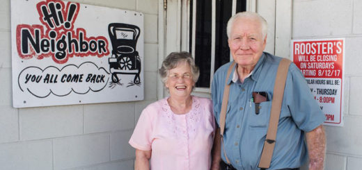 Lowell and Freda Cox stand outside their restaurant, Rooster's