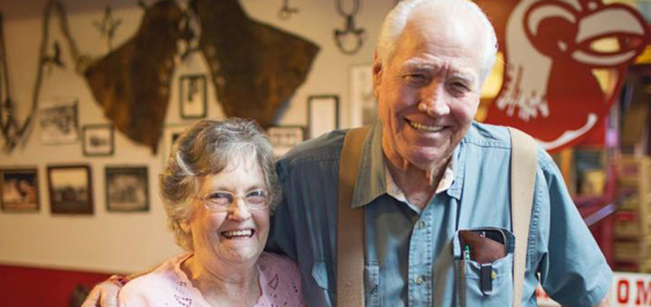 Lowell and Freda Cox standing in their restaurant, Rooster's