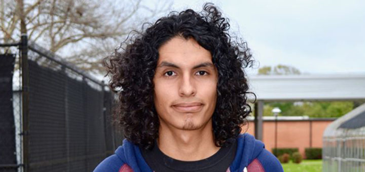 Luis Ruiz stands on the Lee College campus