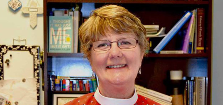 Micki Rios standing in her church