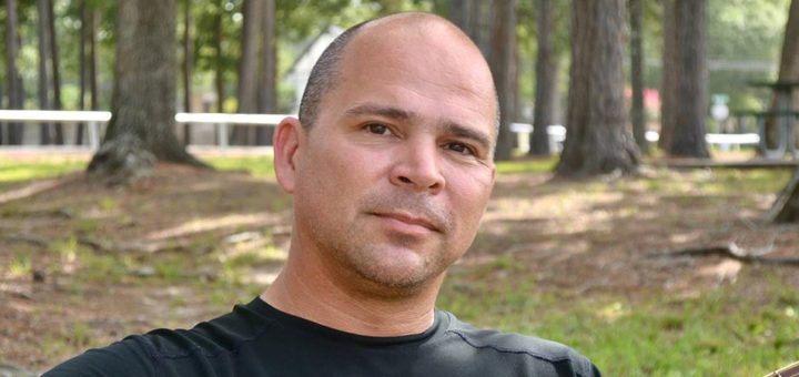 Robert Ortiz sitting in park