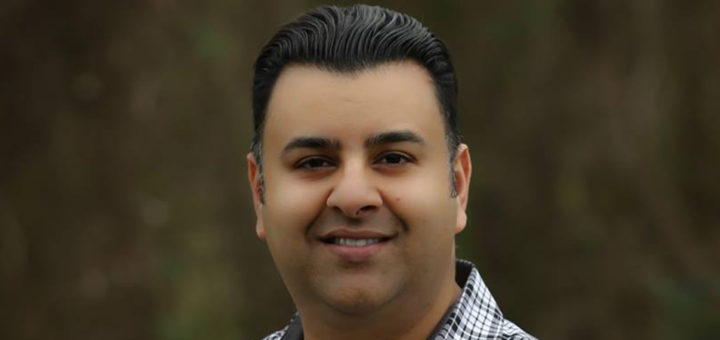 Syed Khalid stands outside