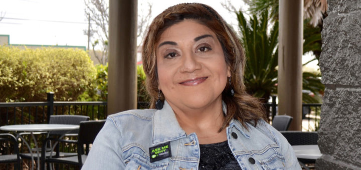 Sylvia Escontrias sitting outside at a coffee shop