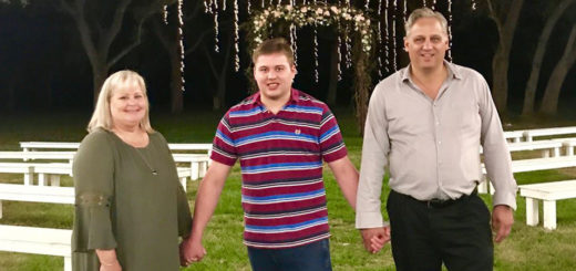 Tracie, Adam and David Johnson hold hands