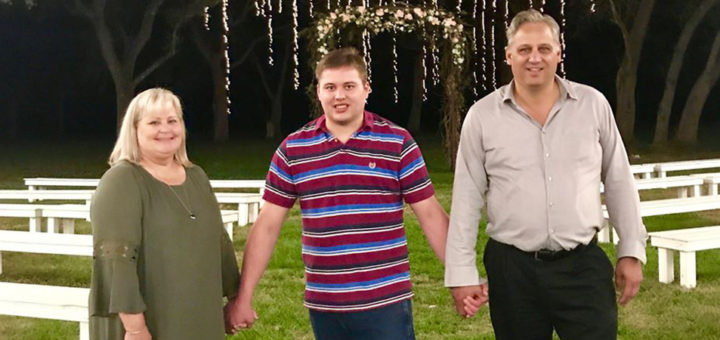 Tracie, Adam and David Johnson hold hands