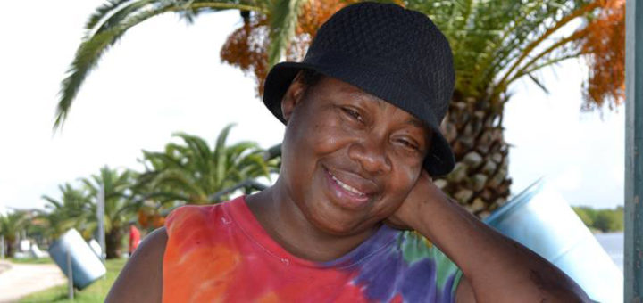 Alberta at a park bench smiling