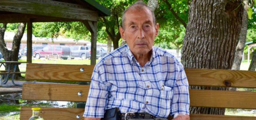 Bill Jones sits on park bench